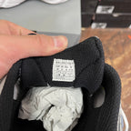 Black inner sock liner with BALENCIAGA size tag and crumpled white lining