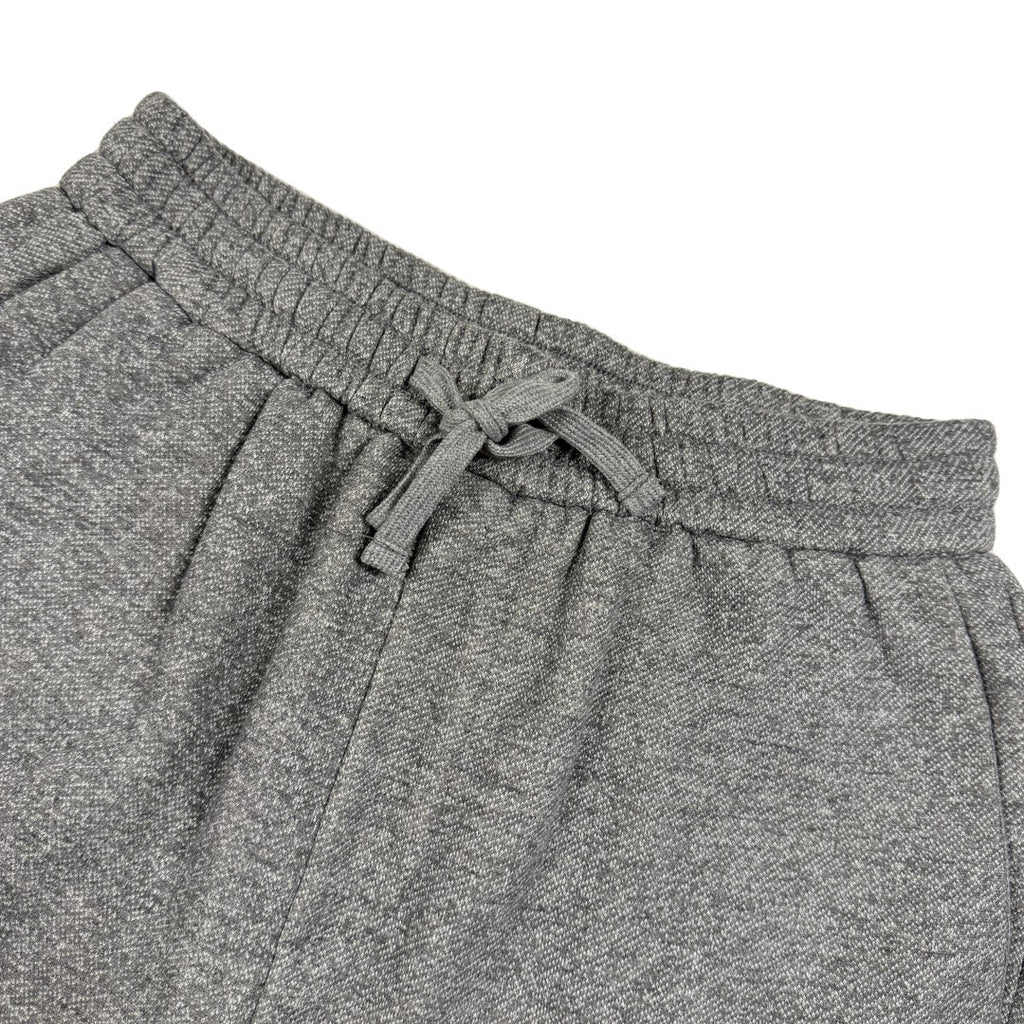 Close-up of gray marl drawstring shorts waistband with gathered elastic and ties