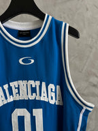 Balenciaga blue tank top with circular logo and white “BALENCIAGA” text