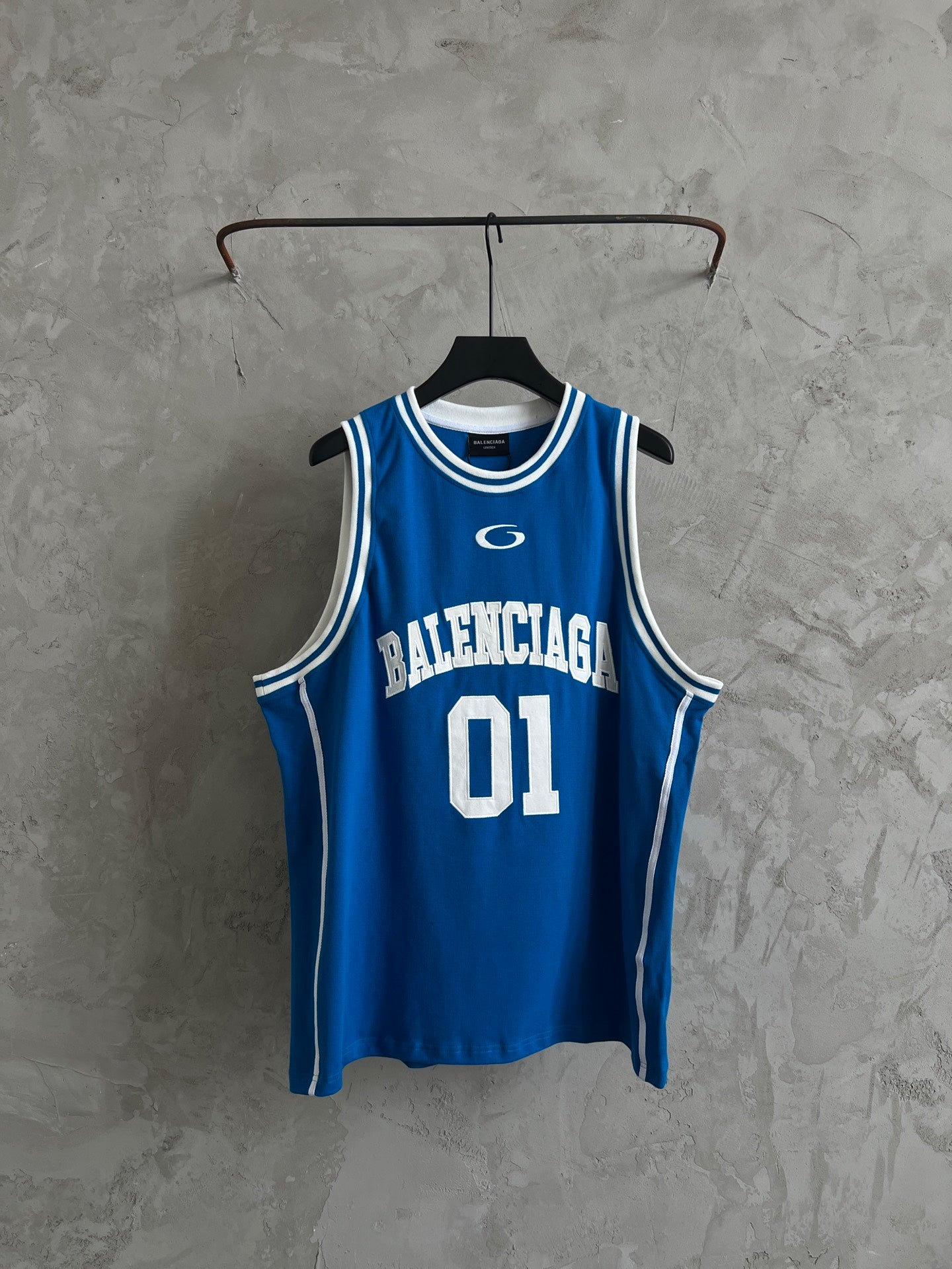 Balenciaga blue sleeveless jersey with white trim and “01” front