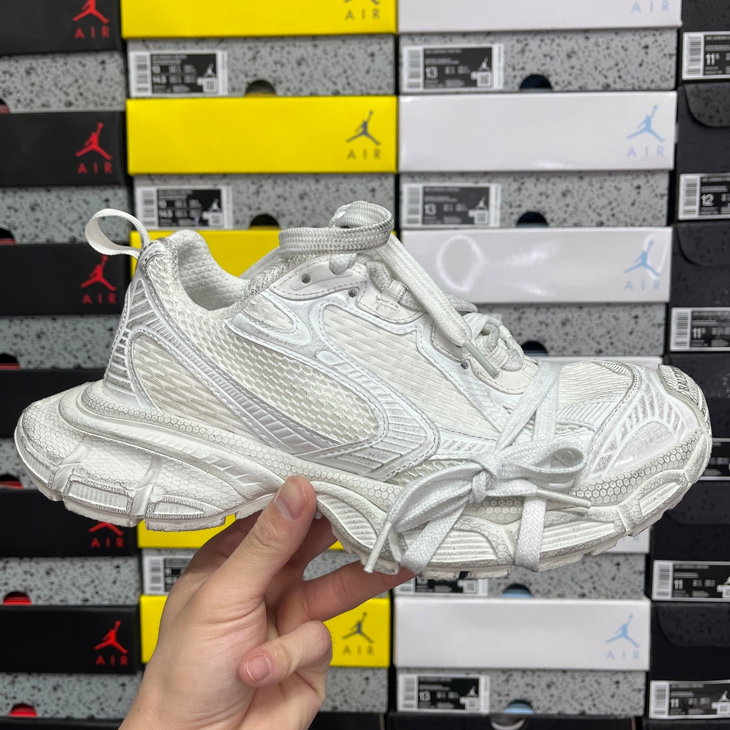 Balenciaga unisex sneaker in white with lace-up front and chunky textured sole
