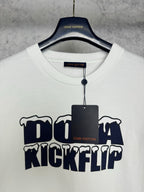 White T-shirt with crew neck and Louis Vuitton tag, featuring navy "DO A KICKFLIP" graphic