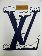 White T-shirt close-up of navy "LV" logo graphic