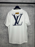 White T-shirt back with large navy "LV" graphic and small "DO A KICKFLIP" text