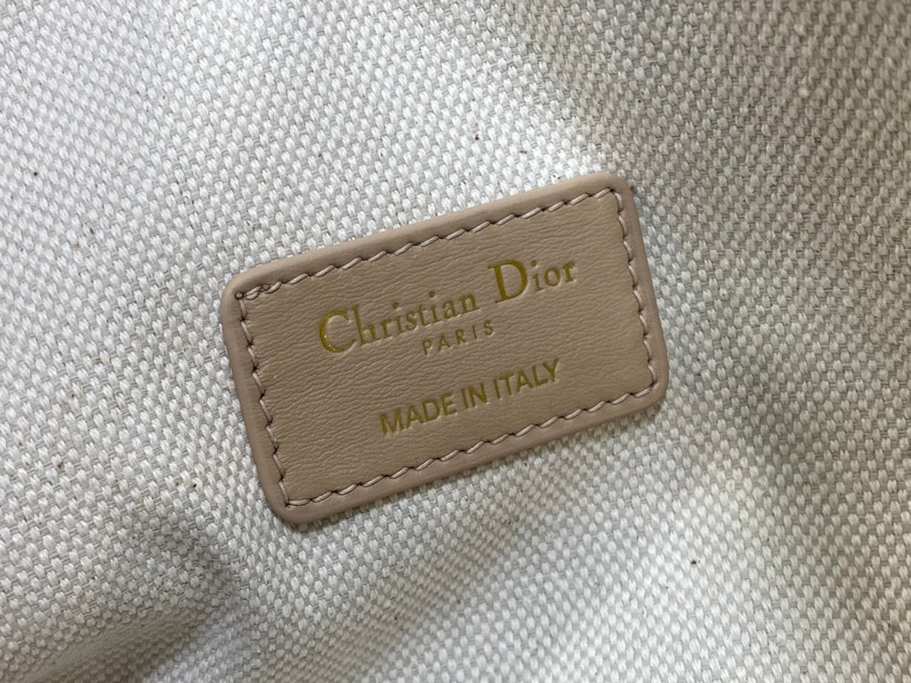 Christian Dior Paris label on beige fabric bag lining, made in Italy