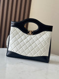 Chanel quilted handbag with dark trim and top handle ring, front view