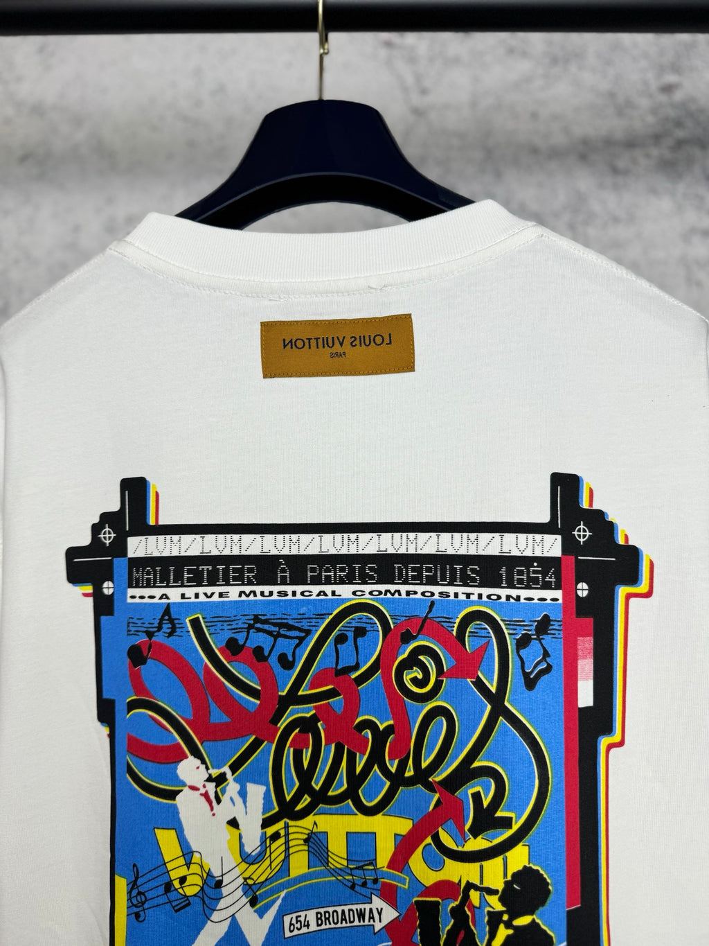 Louis Vuitton short-sleeve T-shirt, white with centered back graphic and “64 Broadway” text