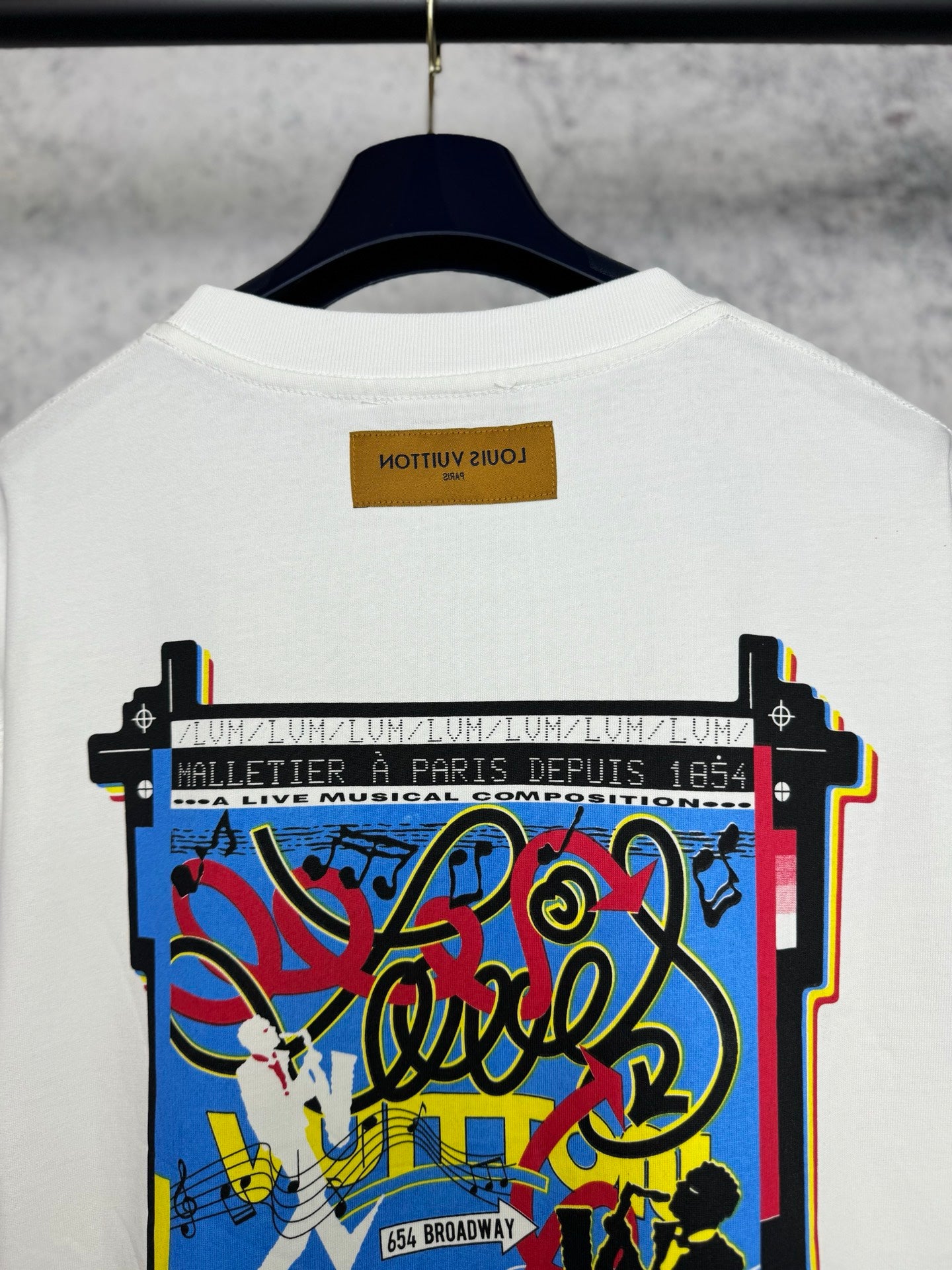 Louis Vuitton short-sleeve T-shirt, white with centered back graphic and “64 Broadway” text