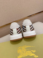 White low-top sneakers with plaid heel inserts and white pull-tab