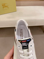 Burberry logo on inside tongue of white lace-up sneaker, plaid trim