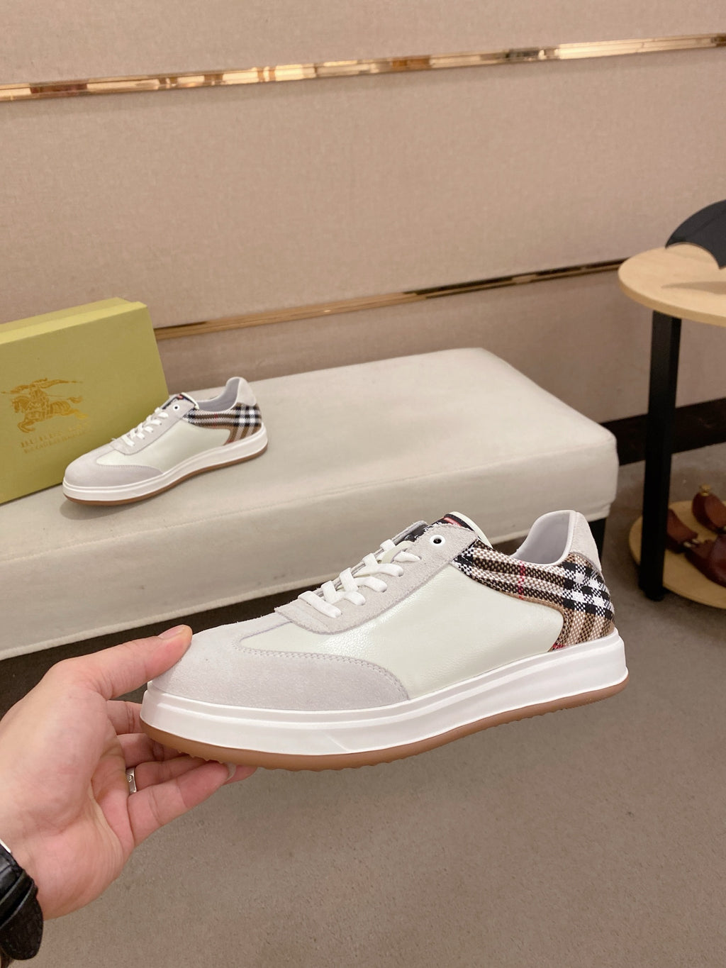 White low-top sneakers with plaid check insets and rubber cup sole