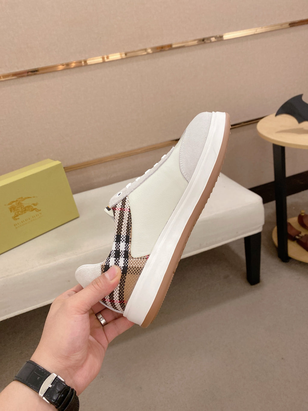 White sneakers with plaid side panel, lace-up vamp, and gum rubber sole