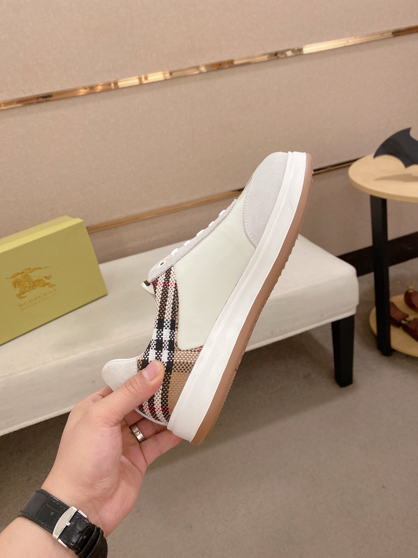White sneakers with plaid side panel, lace-up vamp, and gum rubber sole