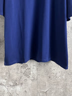 Blue Balenciaga short-sleeve T-shirt bottom hem, showing curved hem and fabric drape.