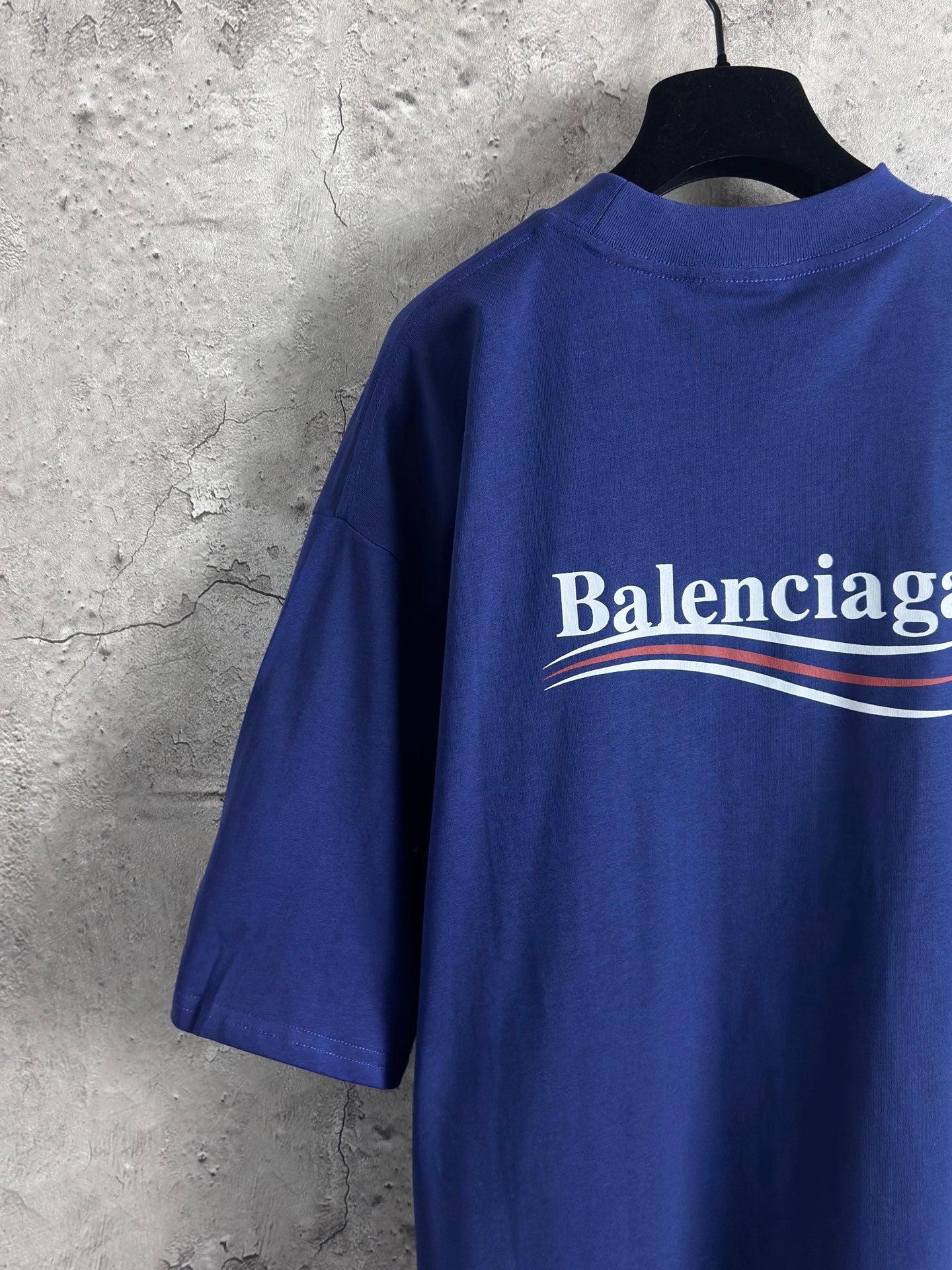 Blue Balenciaga crew-neck T-shirt with short sleeves and large back logo graphic.
