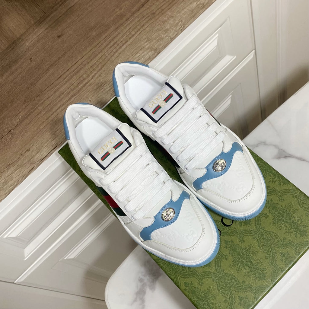 Gucci unisex sneakers with white uppers, blue trim, and green-red stripe on panels