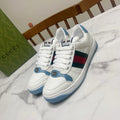 Gucci unisex sneakers in white with blue sole and green-red side stripe detail