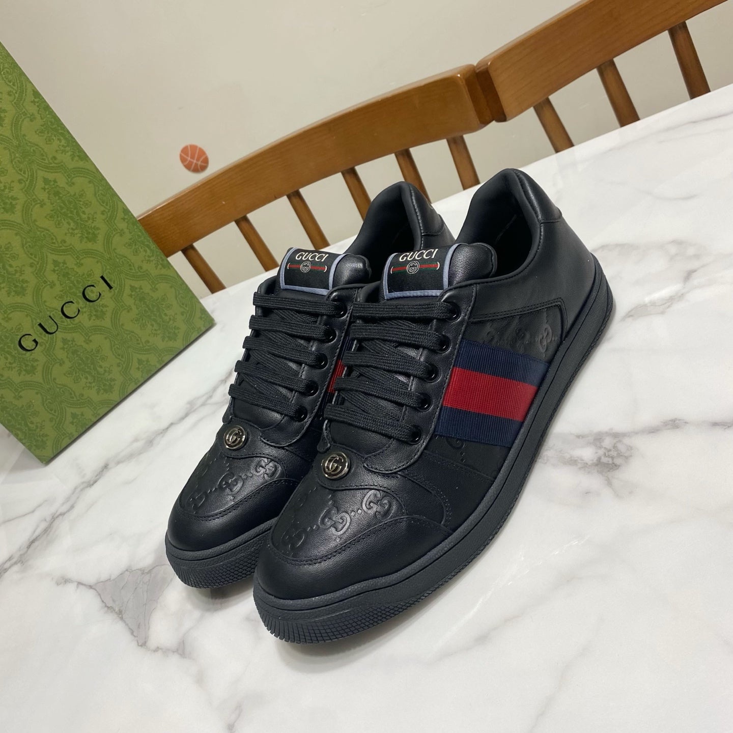 Gucci unisex sneakers, black leather look with web stripe and lace-up front.