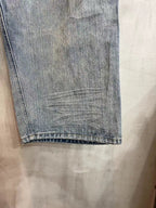 Light blue denim pant leg with straight hem and subtle fade lines