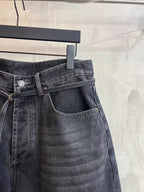 Dark wash denim shorts front detail with button fly, coin pocket, and tied waist drawstring