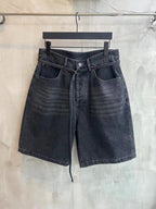 Dark wash denim shorts with belt loops, front pockets, and tied waist drawstring