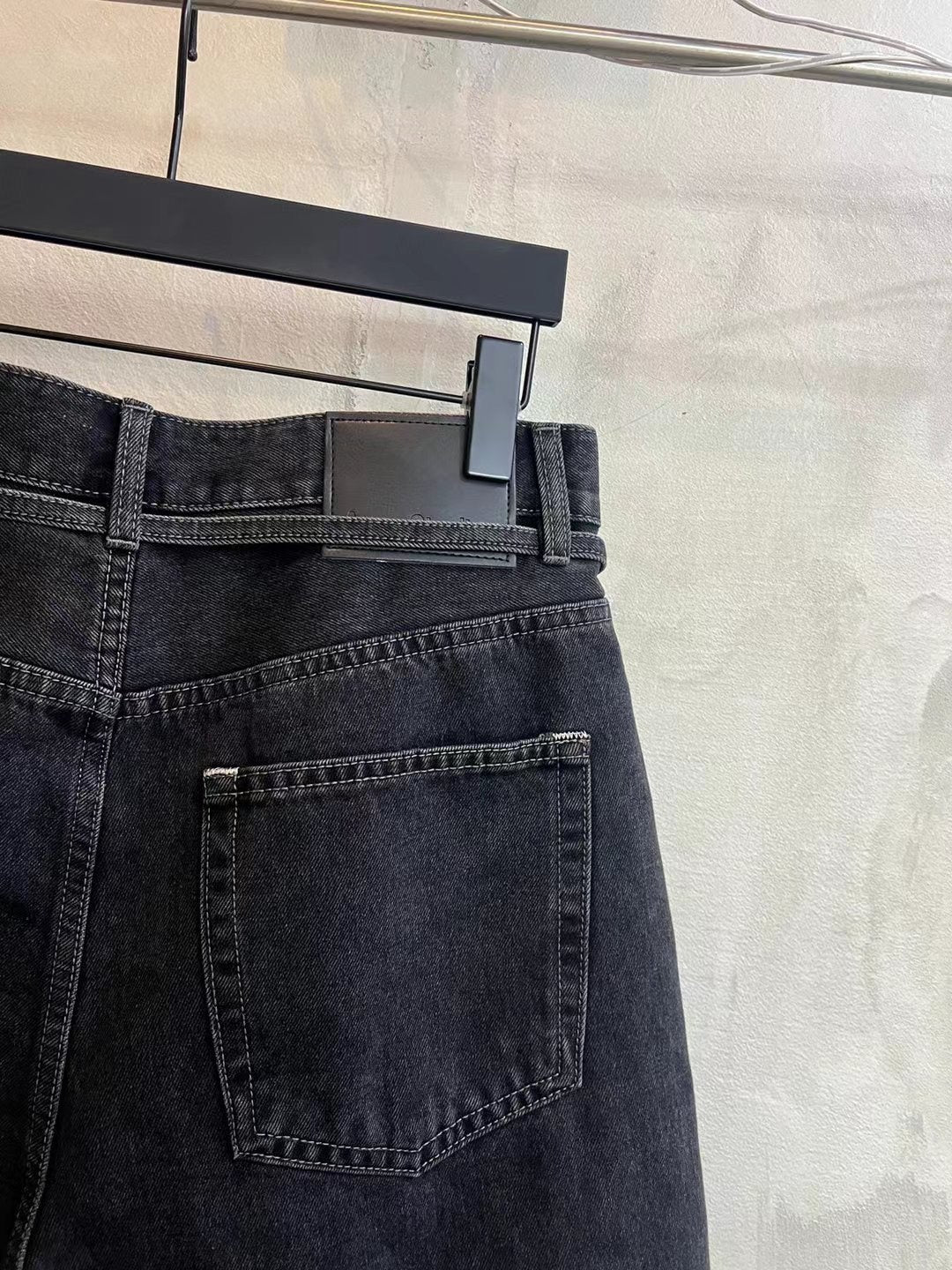 Dark wash denim shorts back detail with large rear patch pocket and belt loops