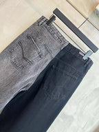 Wide-leg jeans showing two washes: light gray and dark blue, stitched front pockets.