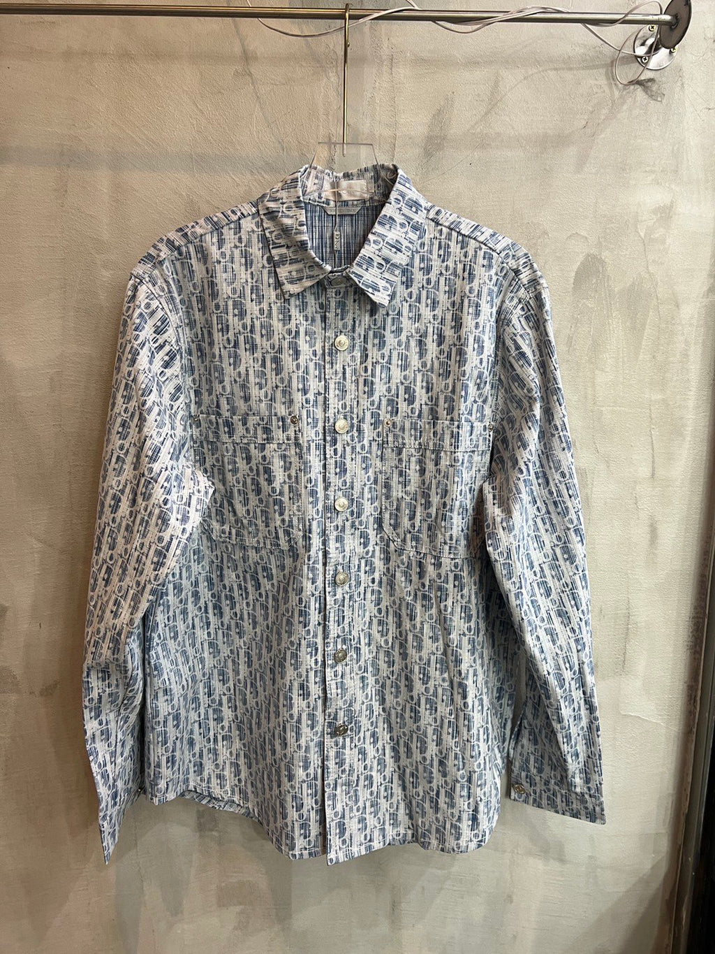 Light blue patterned long-sleeve shirt with button front and pointed collar