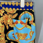 Versace baroque print shorts with light-blue front panel and black gold motifs