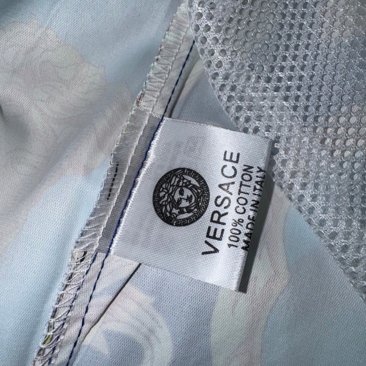 Versace inner fabric label on sheer shorts, white mesh with stitched trim