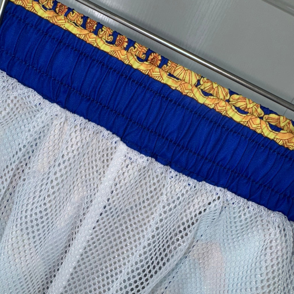 Versace blue and white mesh-lined shorts hem with gold patterned waistband