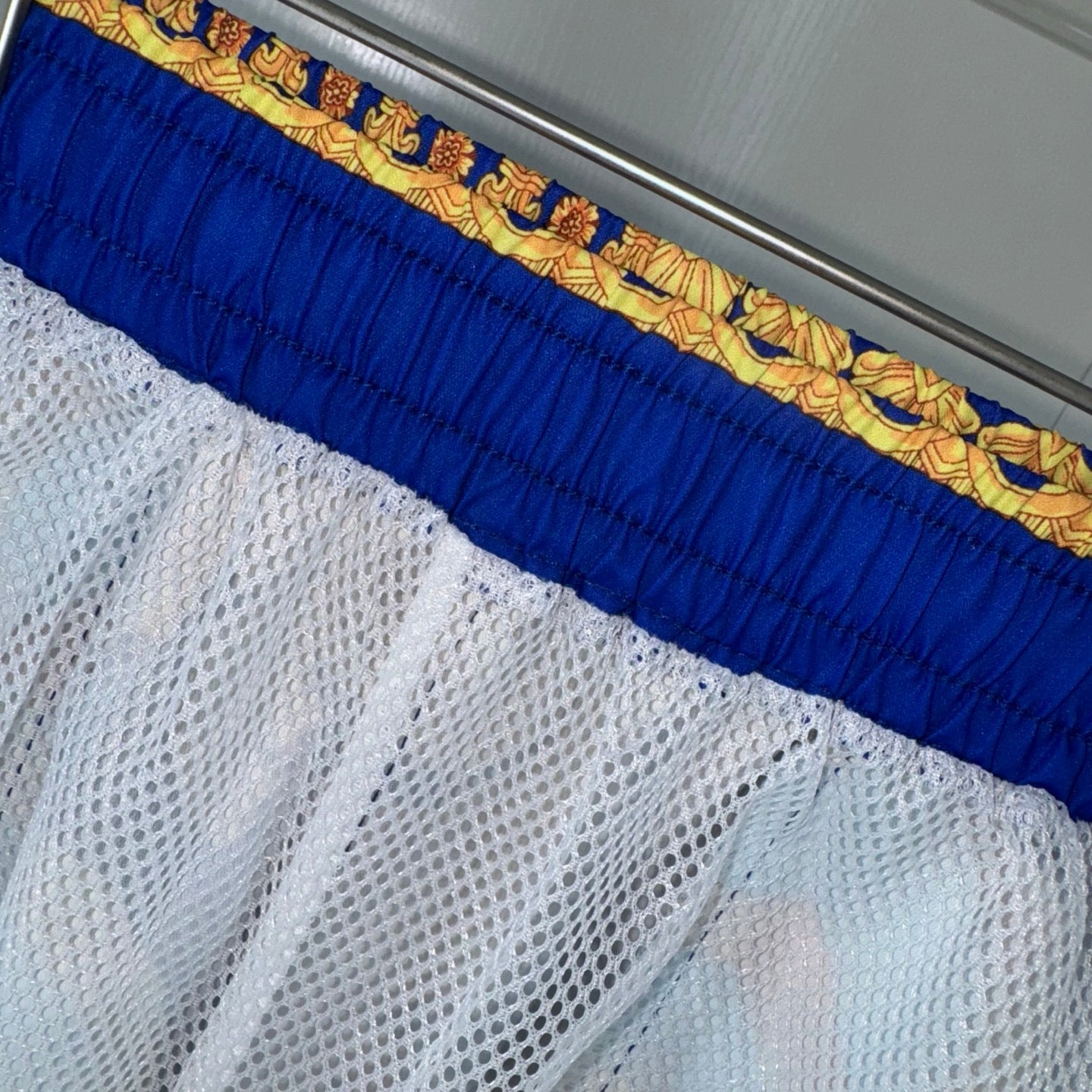 Versace blue and white mesh-lined shorts hem with gold patterned waistband