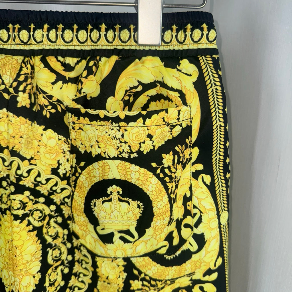 Versace skirt front with black-and-gold baroque medallion and floral scrolls