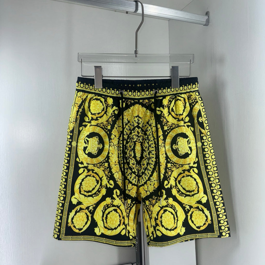 Black and yellow baroque print shorts with drawstring waist and scalloped hem trim