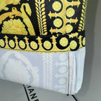 Versace skirt hem with gold-on-dark border and light patterned lining