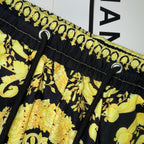 Versace skirt waistband with black elastic, gold print, and drawstring eyelets