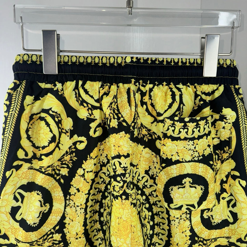 Versace printed skirt with black waistband and ornate gold medallion pattern