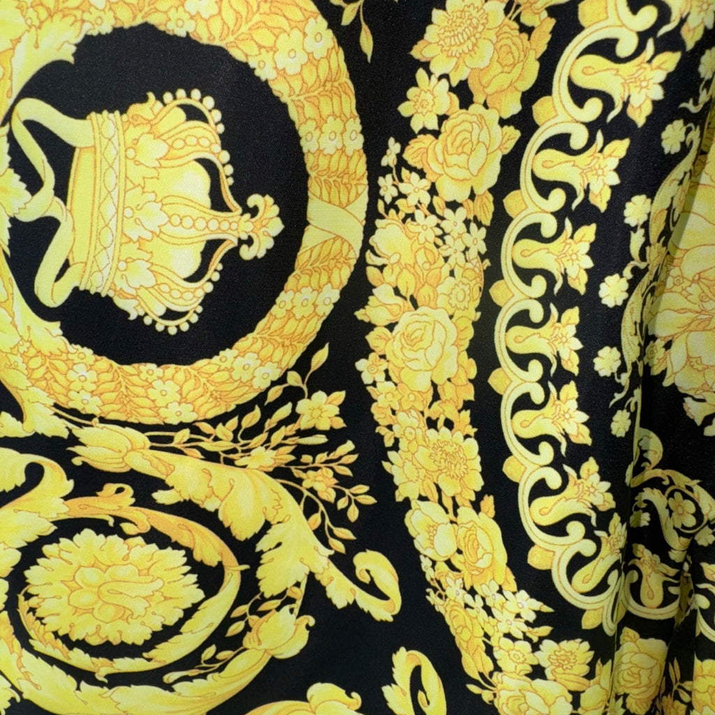 Versace printed skirt in dark fabric with gold Baroque motifs