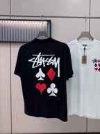 Black short-sleeve T-shirt with Stussy graphic and playing-card symbols on chest