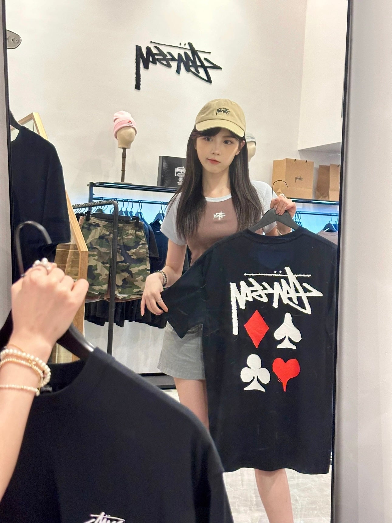 Black graphic T-shirt dress with playing cards and Stussy-style logo