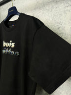 Black short-sleeve T-shirt on a hanger with rhinestone "louis" front graphic