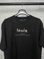 Black short-sleeve T-shirt with rhinestone "louis" front graphic, close-up