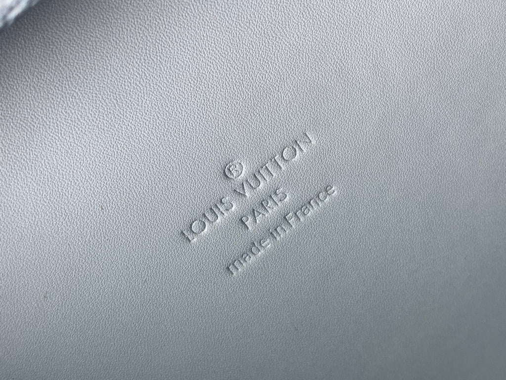 Men's Louis Vuitton bag embossed logo on light blue textured leather