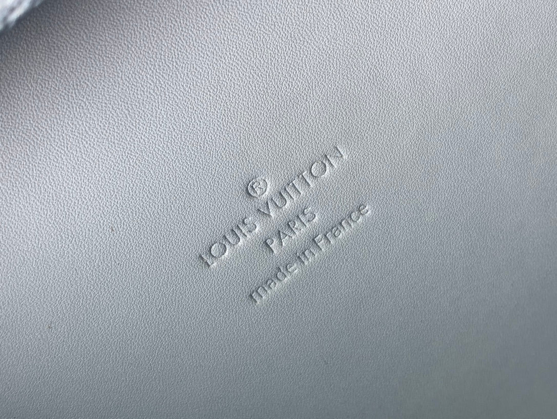 Men's Louis Vuitton bag embossed logo on light blue textured leather