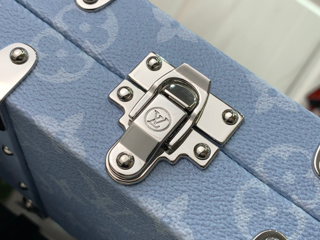Light blue Louis Vuitton bag front clasp plate with silver-tone metal latch