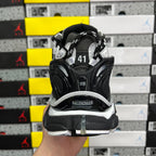 Balenciaga sneakers showing rear cushioning and BALENCIAGA logo on heel strap