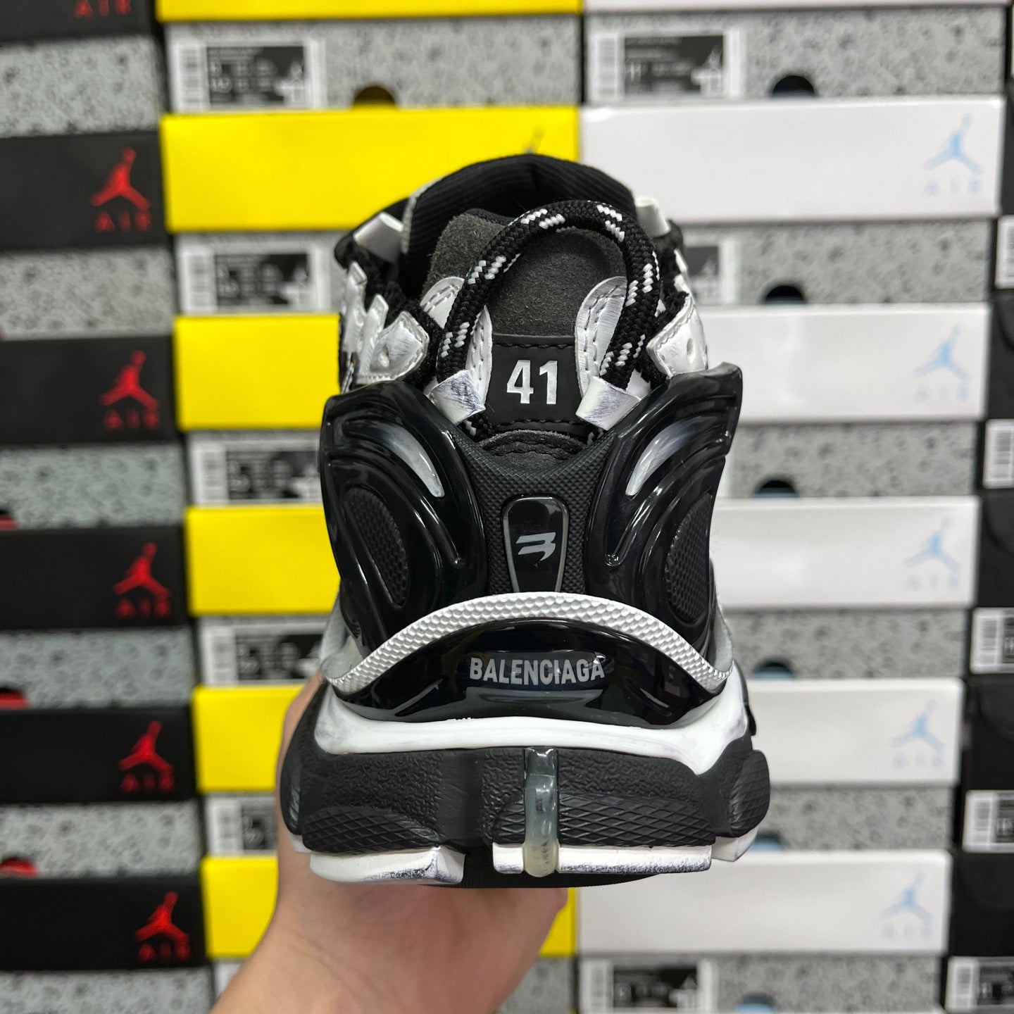 Balenciaga sneakers showing rear cushioning and BALENCIAGA logo on heel strap