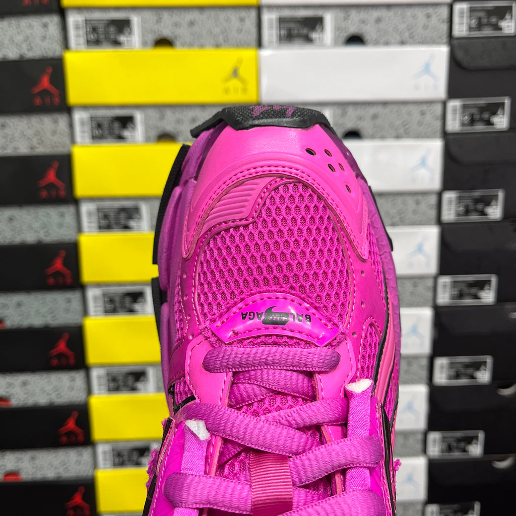 Pink sneaker heel with lace-up collar, textured upper, and mesh panel detail