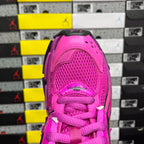 Pink sneaker heel with lace-up collar, textured upper, and mesh panel detail