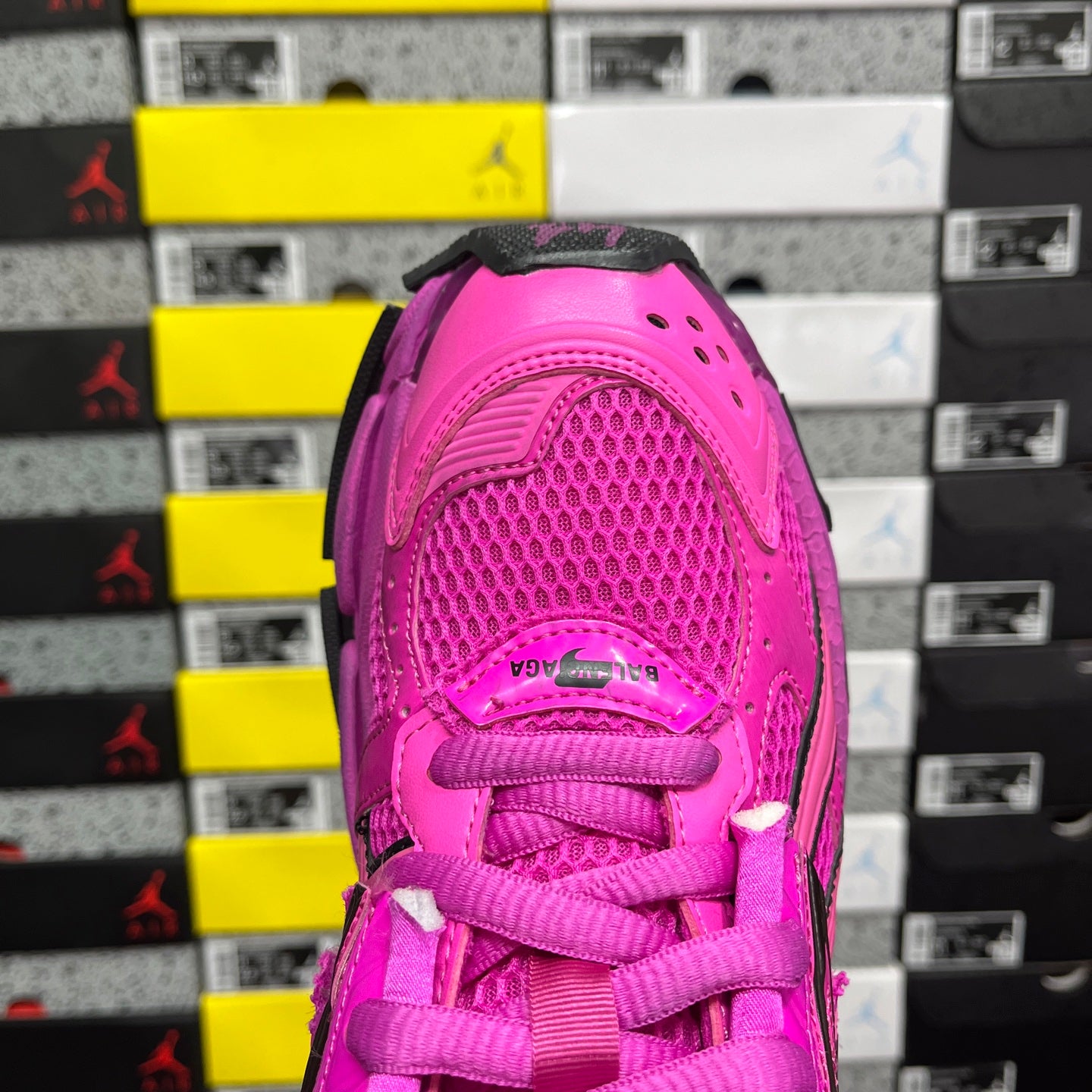 Pink sneaker heel with lace-up collar, textured upper, and mesh panel detail